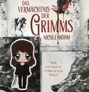 Das Produktbild zeigt ein Magnetlesezeichen mit einer brünetten Frau in einem schwarzen Outfit. In ihrer rechten Hand hält sie ein Schwert.